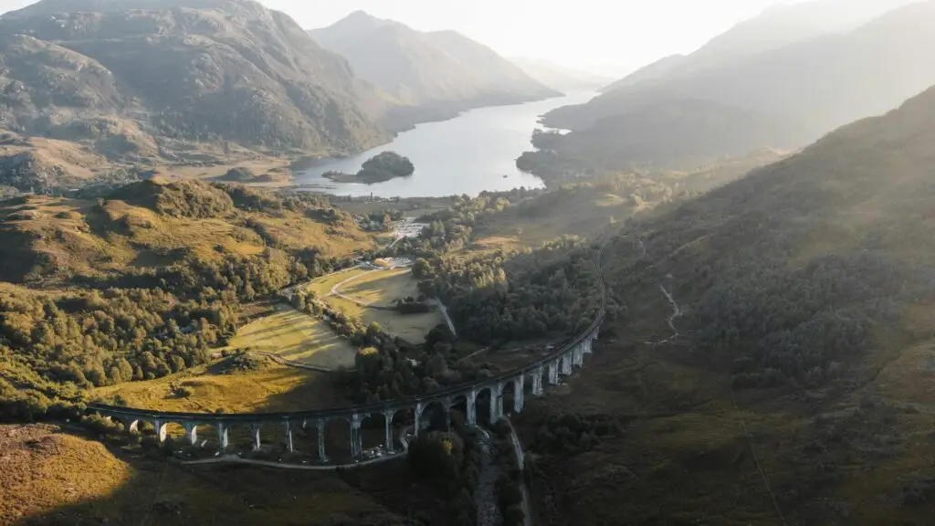 Stunning aerial view of Glenfinnan Viaduct and Loch Shiel in Scotland's Highlands.